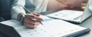Woman with Calendar iStock 1206239375 670x270